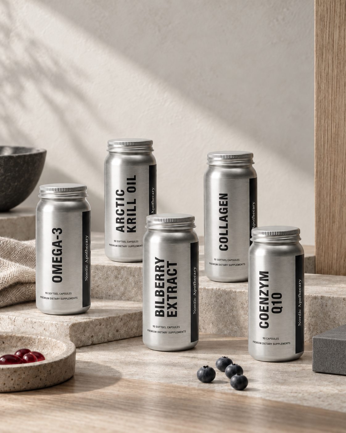 Nordic Apothecary Omega-3, krill oil, bilberry, collagen and Q10 bottles on stone steps